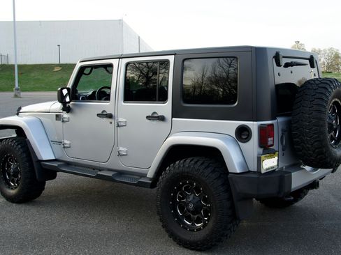 Used 2010 Jeep Wrangler Unlimited Sahara w/ Dual Top Group image 1