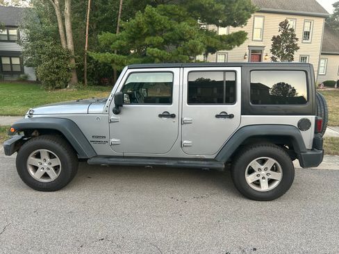 Used 2014 Jeep Wrangler Unlimited Sport w/ Dual Top Group image 1