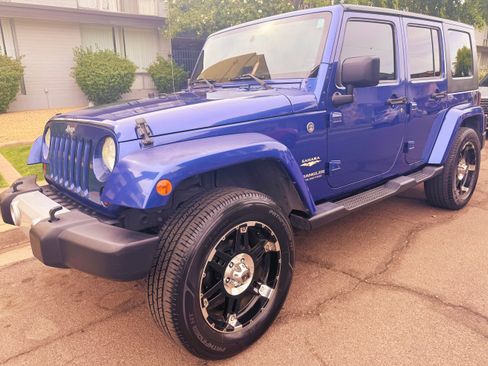Used 2010 Jeep Wrangler Unlimited Sahara w/ Trailer Tow Group AWD/4WD image 1