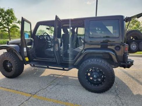 Used 2012 Jeep Wrangler Unlimited Sahara w/ Dual Top Group image 1