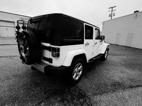 Used 2013 Jeep Wrangler Unlimited Sahara w/ Dual Top Group image 2