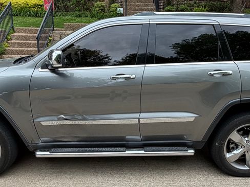 Used 2012 Jeep Grand Cherokee Overland w/ Mopar Chrome Edition Group AWD/4WD image 1