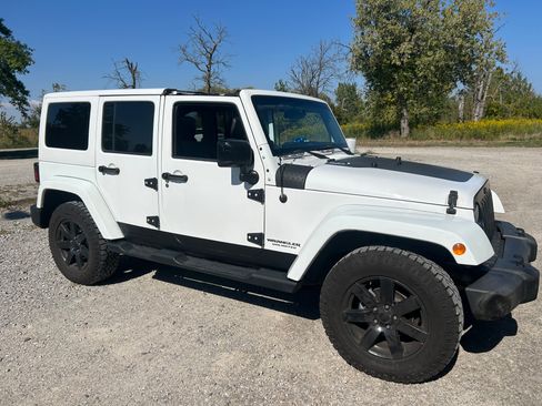Used 2014 Jeep Wrangler Unlimited Sahara w/ Dual Top Group image 1