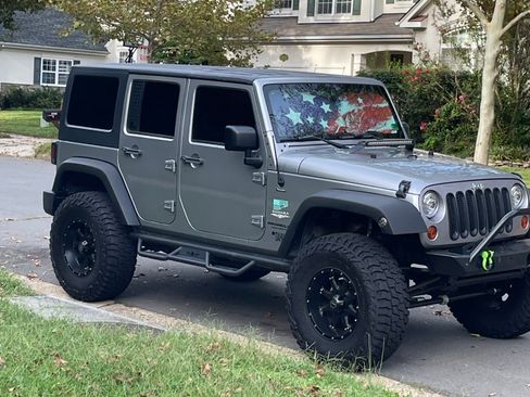 Used 2013 Jeep Wrangler Unlimited Sahara AWD/4WD image 1