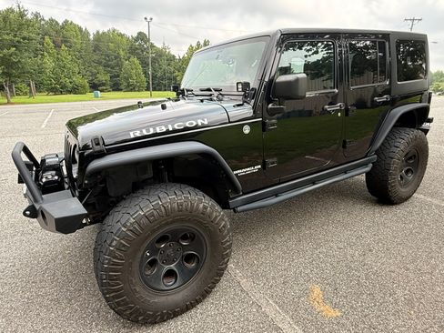 Used 2012 Jeep Wrangler Unlimited Rubicon w/ Dual Top Group AWD/4WD image 1