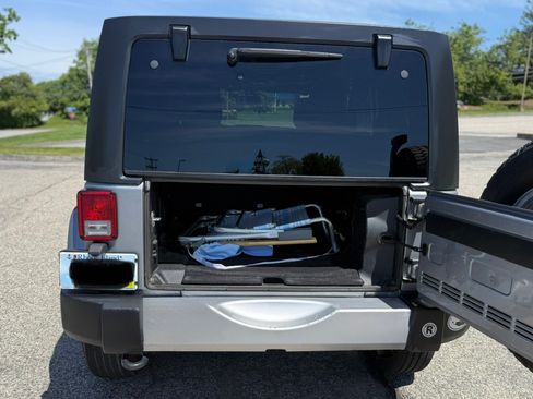 Used 2014 Jeep Wrangler Unlimited Sahara w/ Dual Top Group AWD/4WD image 24