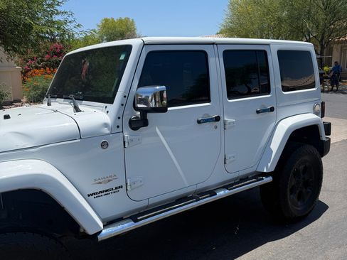 Used 2014 Jeep Wrangler Unlimited Sahara w/ Mopar Chrome Edition Group AWD/4WD image 2