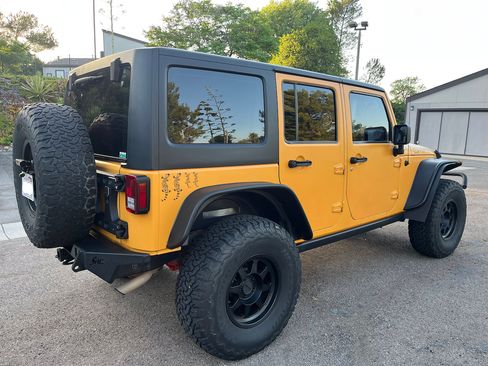 Used 2012 Jeep Wrangler Unlimited Sport w/ Black Appearance Group AWD/4WD image 9