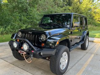 Used 2012 Jeep Wrangler Unlimited Sahara w/ Dual Top Group AWD/4WD video 1