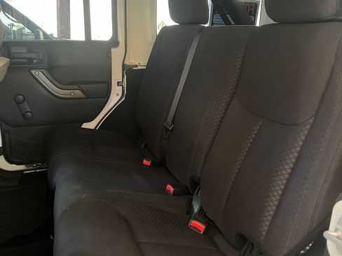 Used 2013 Jeep Wrangler Unlimited Sport w/ Mopar Black Appearance Group AWD/4WD image 4