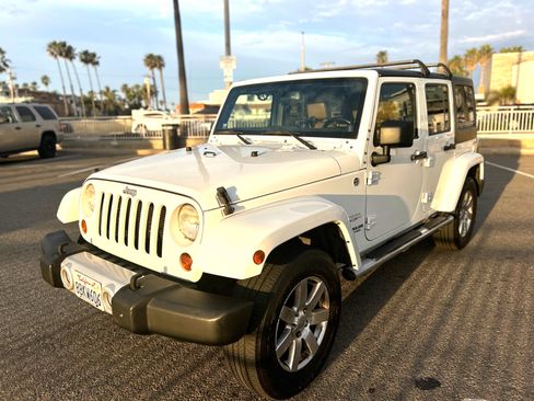 Used 2013 Jeep Wrangler Unlimited Sahara w/ Dual Top Group image 1