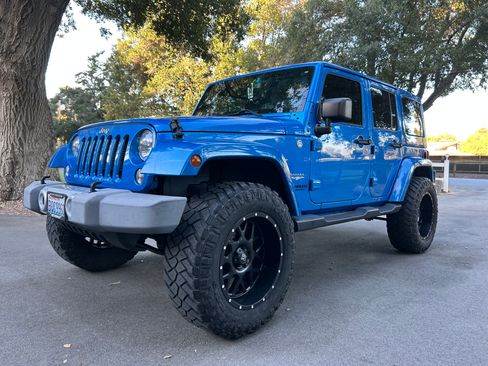 Used 2014 Jeep Wrangler Unlimited Sahara w/ Connectivity Group image 1