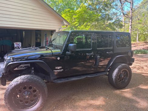 Used 2014 Jeep Wrangler Unlimited Sahara w/ Dual Top Group image 1