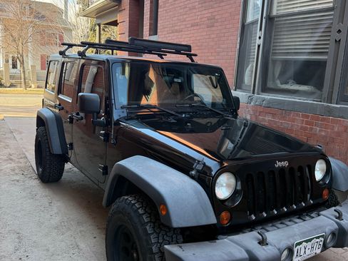 Used 2012 Jeep Wrangler Unlimited Sport image 1