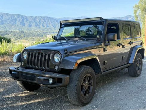 Used 2016 Jeep Wrangler Unlimited Sahara image 1