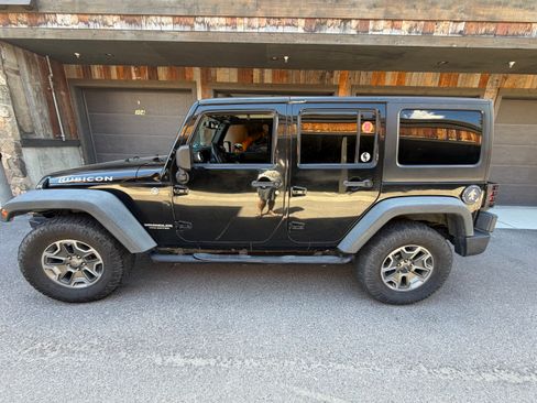 Used 2014 Jeep Wrangler Unlimited Rubicon w/ Max Tow Package AWD/4WD image 1