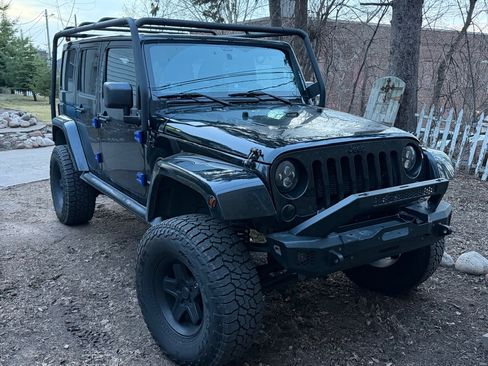 Used 2012 Jeep Wrangler Unlimited Sahara AWD/4WD image 1