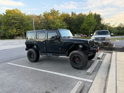 Used 2011 Jeep Wrangler Unlimited Sport AWD/4WD image 1
