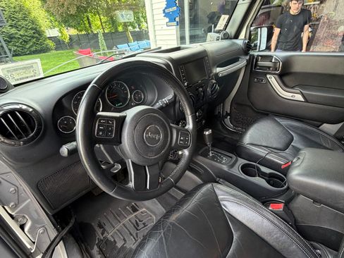 Used 2013 Jeep Wrangler Unlimited Sahara w/ Dual Top Group AWD/4WD image 12