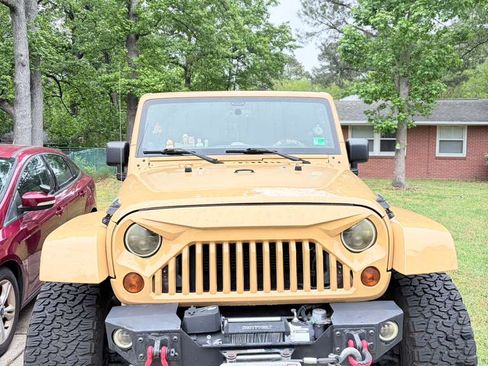 Used 2013 Jeep Wrangler Unlimited Sahara w/ Mopar Chrome Edition Group AWD/4WD image 1