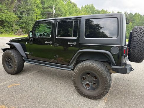Used 2012 Jeep Wrangler Unlimited Rubicon w/ Dual Top Group AWD/4WD image 6