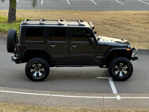 Used 2010 Jeep Wrangler Unlimited Rubicon w/ Dual Top Group AWD/4WD image 17