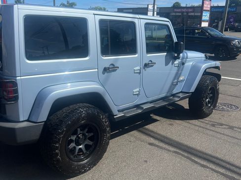 Used 2014 Jeep Wrangler Unlimited Sahara w/ Dual Top Group image 2