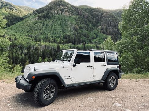 Used 2013 Jeep Wrangler Unlimited Sport w/ Mopar Black Appearance Group AWD/4WD image 2