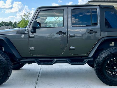 Used 2014 Jeep Wrangler Unlimited Sahara w/ Connectivity Group AWD/4WD image 1