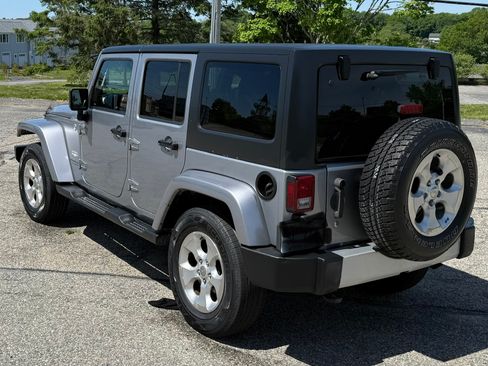 Used 2014 Jeep Wrangler Unlimited Sahara w/ Dual Top Group AWD/4WD image 2