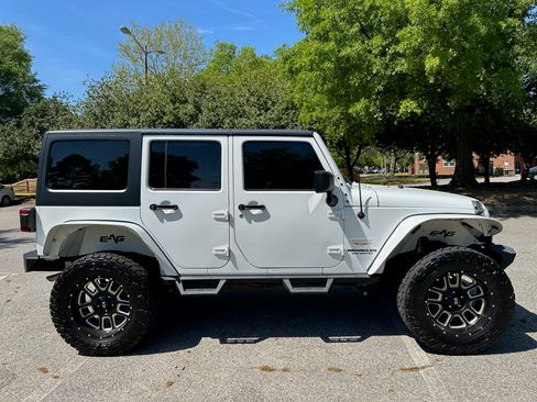 Used 2013 Jeep Wrangler Unlimited Sahara AWD/4WD image 1