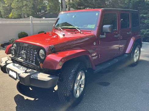 Used 2013 Jeep Wrangler Unlimited Sahara w/ Dual Top Group AWD/4WD image 1