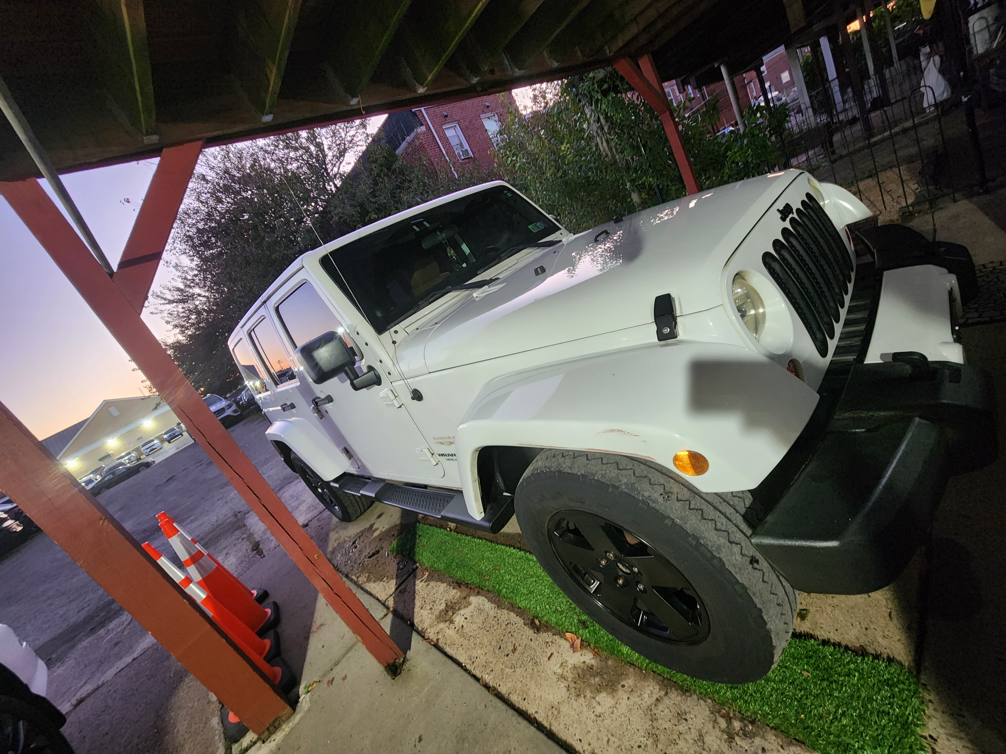 Used 2012 Jeep Wrangler Unlimited Sahara w/ Dual Top Group AWD/4WD image 11
