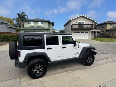Used 2015 Jeep Wrangler Unlimited Sport w/ Mopar Black Appearance Group