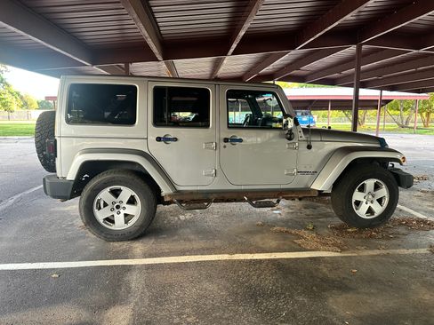 Used 2012 Jeep Wrangler Unlimited Sahara w/ Mopar Chrome Edition Group AWD/4WD image 1