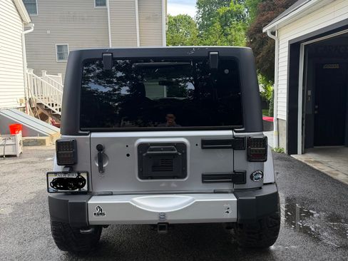 Used 2013 Jeep Wrangler Unlimited Sahara w/ Dual Top Group AWD/4WD image 6