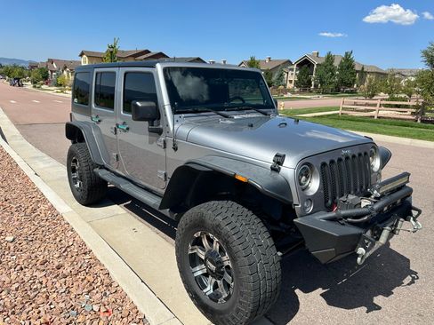 Used 2014 Jeep Wrangler Unlimited Sahara w/ Dual Top Group image 1