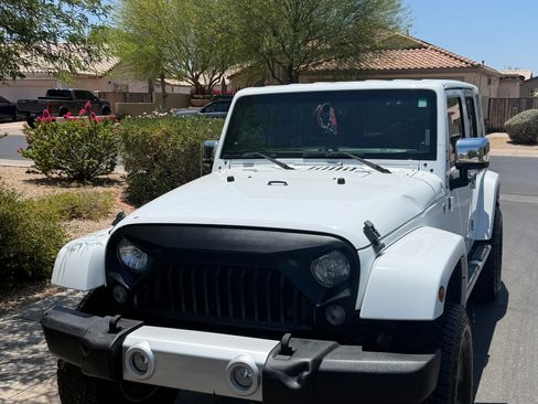 Used 2014 Jeep Wrangler Unlimited Sahara w/ Mopar Chrome Edition Group AWD/4WD image 1