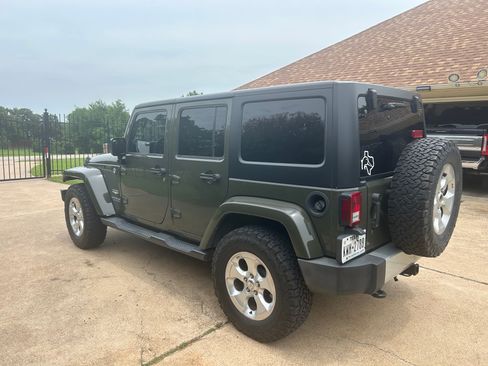 Used 2015 Jeep Wrangler Unlimited Sahara w/ Dual Top Group AWD/4WD image 1