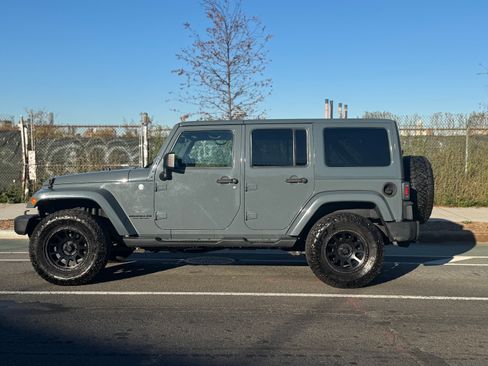Used 2014 Jeep Wrangler Unlimited Sahara w/ Dual Top Group image 1