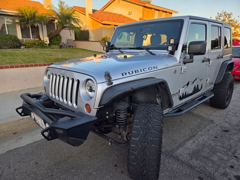 Used 2009 Jeep Wrangler Unlimited Rubicon w/ Dual Top Group image 1