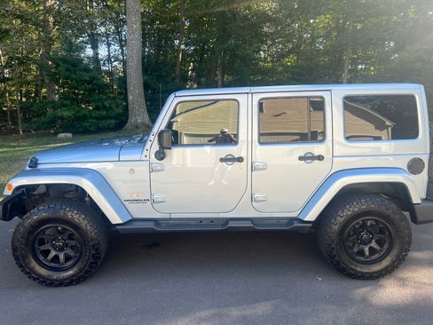 Used 2014 Jeep Wrangler Unlimited Sahara w/ Dual Top Group image 1