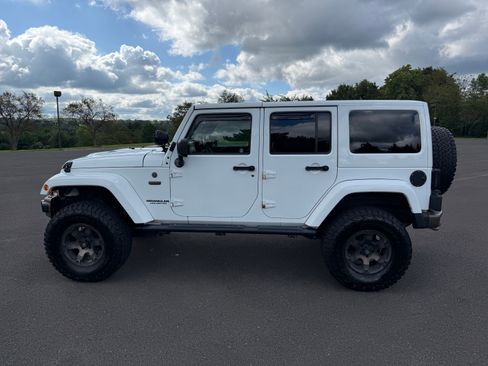 Used 2016 Jeep Wrangler Unlimited Sahara AWD/4WD image 1