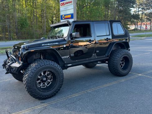 Used 2012 Jeep Wrangler Unlimited Rubicon w/ Dual Top Group image 1