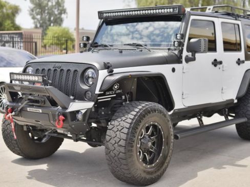 Used 2016 Jeep Wrangler Unlimited Sport image 1