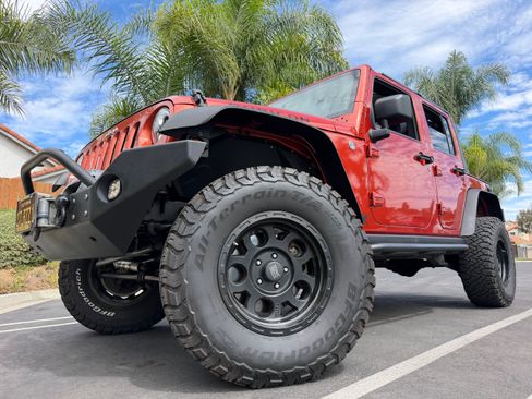 Used 2009 Jeep Wrangler Unlimited Rubicon w/ Dual Top Group AWD/4WD image 1