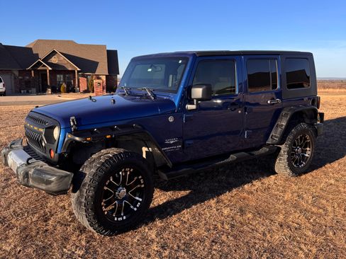 Used 2009 Jeep Wrangler Unlimited Sahara w/ Dual Top Group image 1