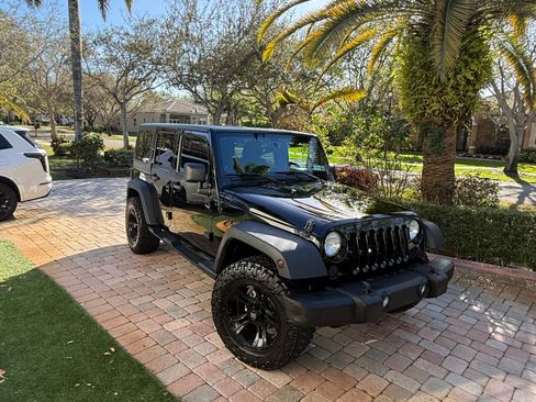 Used 2013 Jeep Wrangler Unlimited Sport image 1