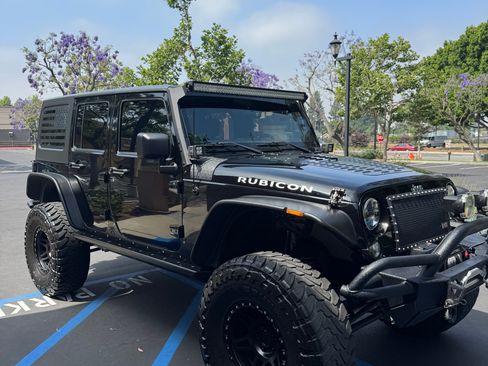 Used 2013 Jeep Wrangler Unlimited Sport AWD/4WD image 1