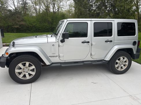 Used 2011 Jeep Wrangler Unlimited 70th Anniversary w/ Dual Top Group AWD/4WD image 1